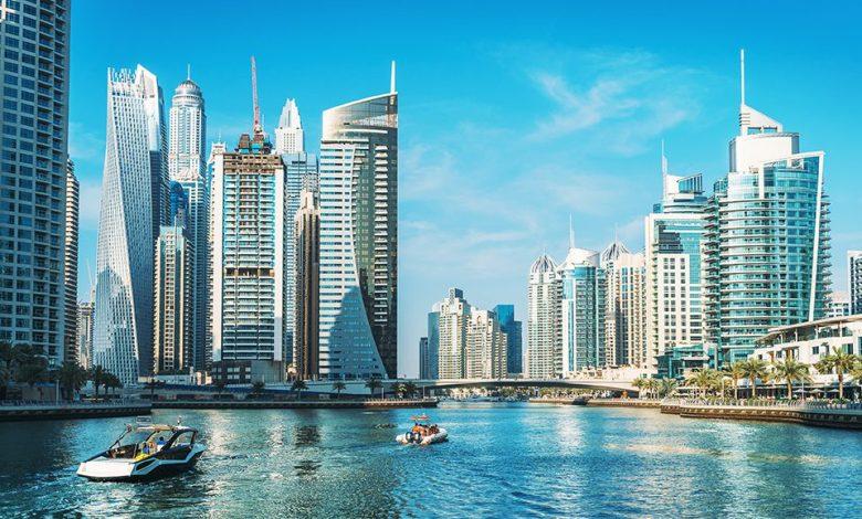 Panorama of Dubai Marina in UAE, modern skyscrapers and port with luxury yachts Source: techbullion.com