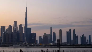 A picture shows people cycling with a general view of the Dubai skyline including Burj Khalifa, the world�s tallest building on November 24, 2023. (Photo by Karim SAHIB / AFP) Agence France-Presse (AFP)/AFP Source: Zawya.com