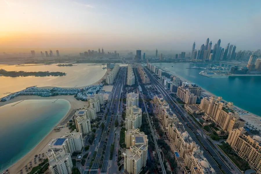 The Sun rises over the city at The Palm Jumeirah on April 10, 2022 in Dubai, United Arab Emirates. (Photo by Laszlo Szirtesi:Getty Images) Source: Zawya.com