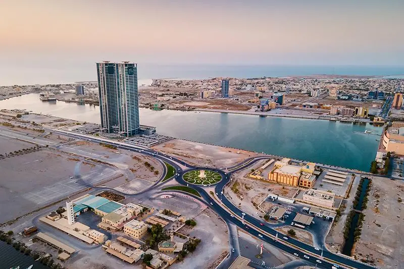 Ras al Khaimah emirate cityscape skyline rising over the mangroves and the creek in the United Arab Emirates at sunset. Getty Images Source: Zawya.com