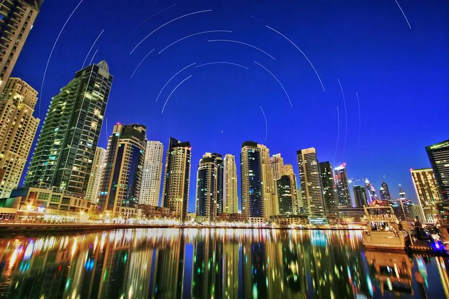 Image stacking composition of star trails around Polaris for more than 3 hours over Dubai Marina skyline, May, 2014. Getty Images Image used for illustrative purpose. Getty Images Source: Zawya.com