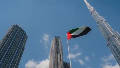 United Arab Emirates flag flying against Dubai downtown skyline. Getty Images Image used for illustrative purpose. Source: Zawya.com