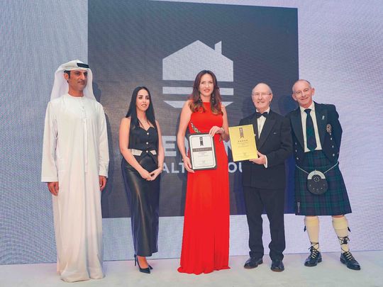 Diana Magariu, CEO of Key One Realty Group (third from right) at the award ceremony.