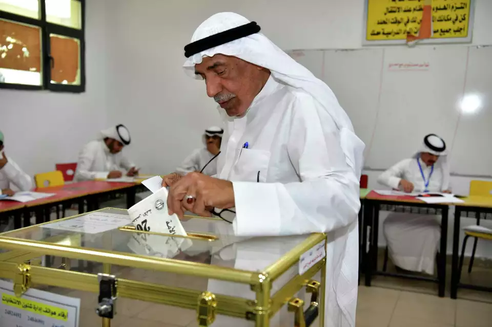 A man casts his vote for the National Assembly elections at Salem Al Nawaf school in Al Riqqa district, Kuwait, Thursday, April 4, 2024. Kuwait votes in its 4th election in as many years in its latest attempt to end political gridlock. Jaber Abdulkhaleg/AP