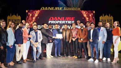 Team Homes 4 Life Real Estate receiving the award from Danube Chairman Rizwan Sajan