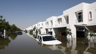 Cars lie partially submerged in water at a residential complex following heavy rainfall, in Dubai, United Arab Emirates, April 18, 2024. (Reuters)