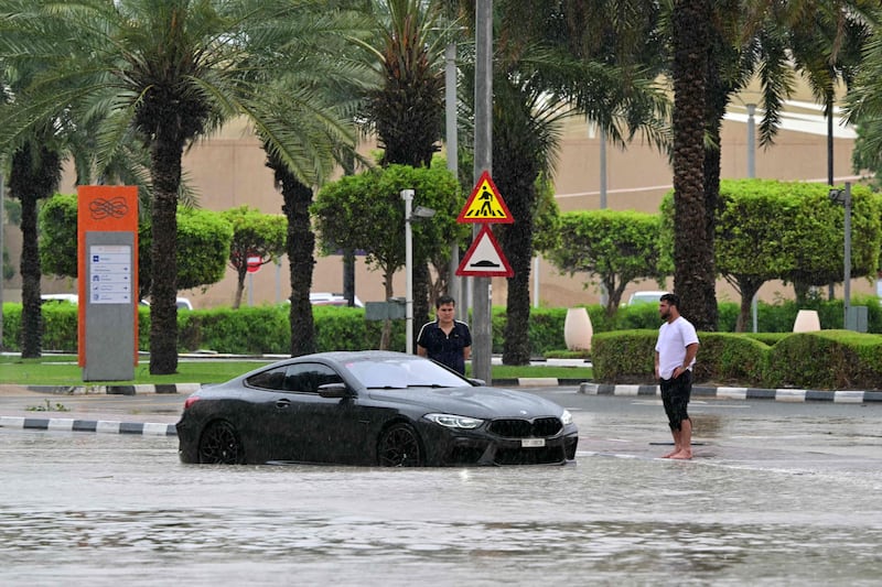 A car is stranded on a flooded street in Dubai on May 2 as heavy rains returned two weeks after record downpours. AFP